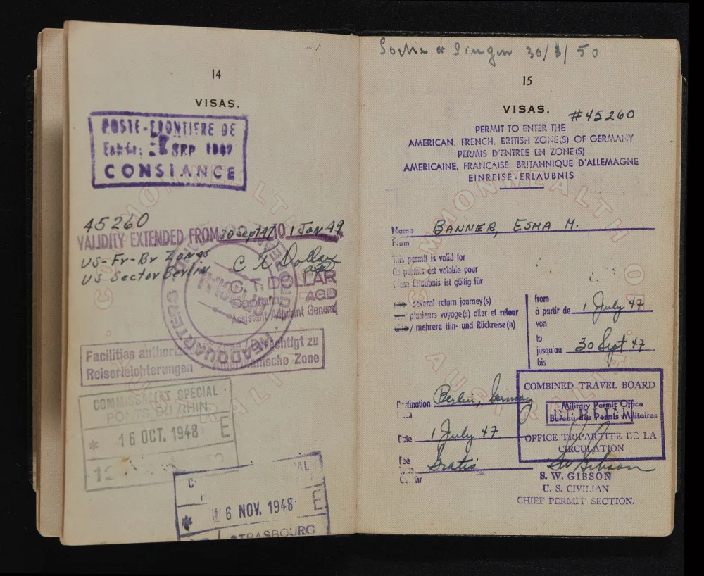 An old passport open to its visa pages with multilingual stamps, the kind of official document people translate to and from Japanese