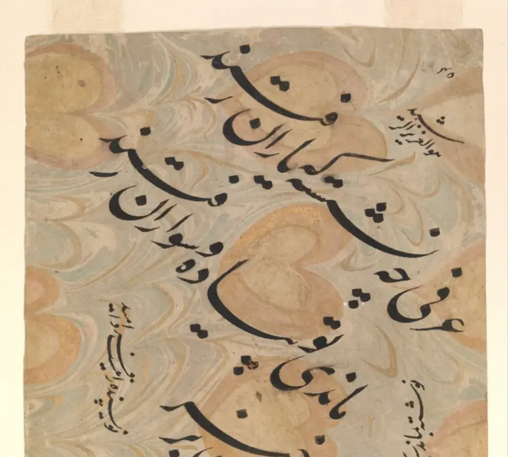 Persian Nastaliq calligraphy on aged paper, the flowing cursive script style used in formal Farsi documents and literary manuscripts